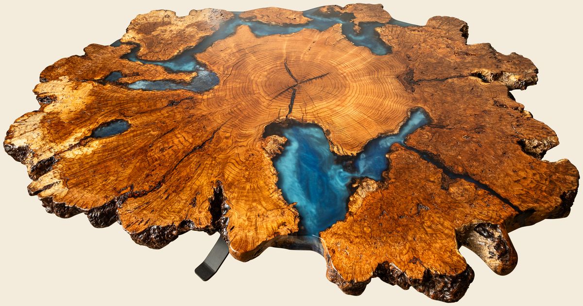 Round burl table with a deep blue epoxy center